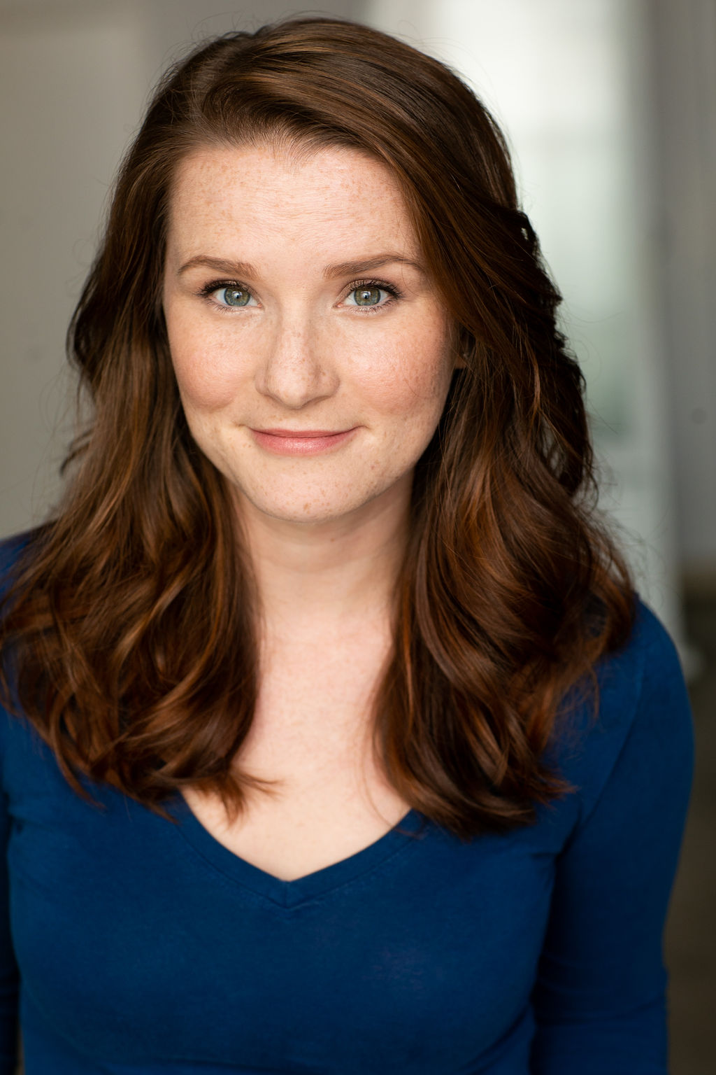 Brigid in a blue blouse